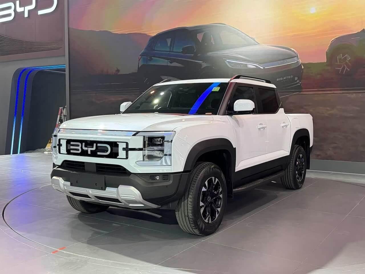 White BYD Shark 6 pickup viewed from the rear